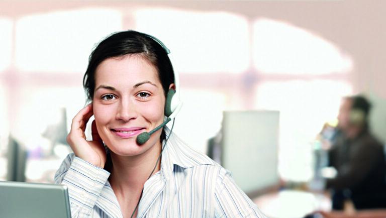 Young and kind female customer cervice representative at an IT company.